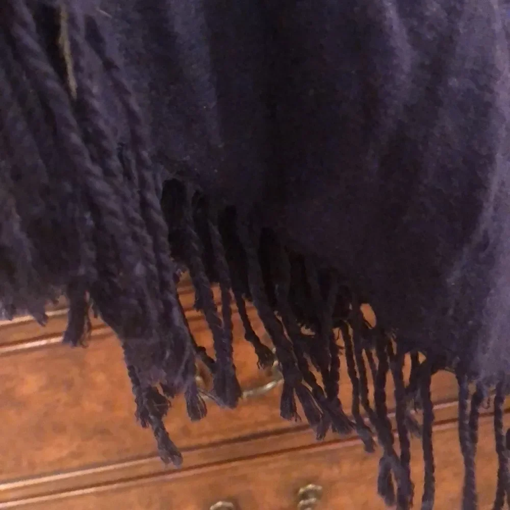Blue scarf with grey stars on it